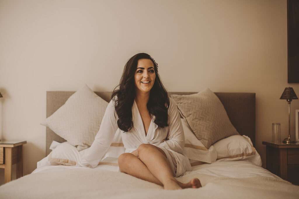 bride poses for a portrait in the bridal suite at Colshaw Hall