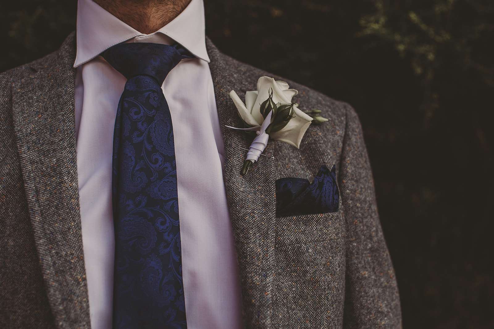 detail photo of grooms suit