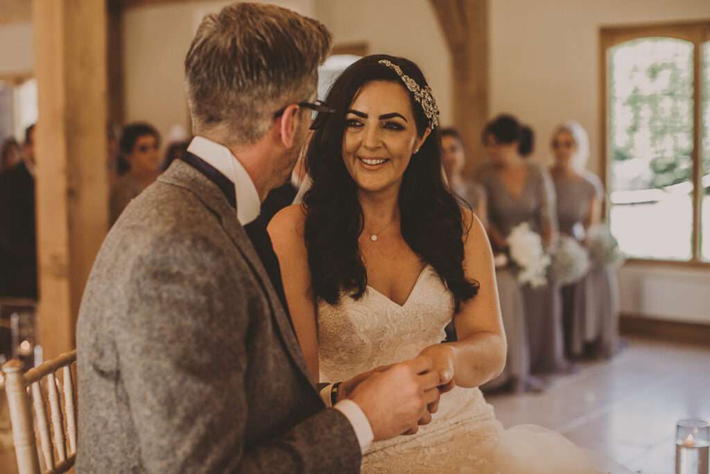 bride and groom exchange vowsd during wedding ceremony