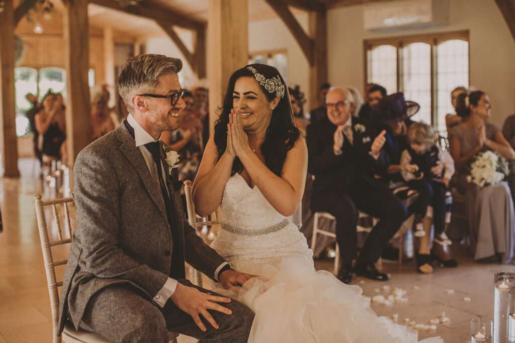 bride and groom celebrating after exchanging vows during their wedding ceremony at Colshaw Hall