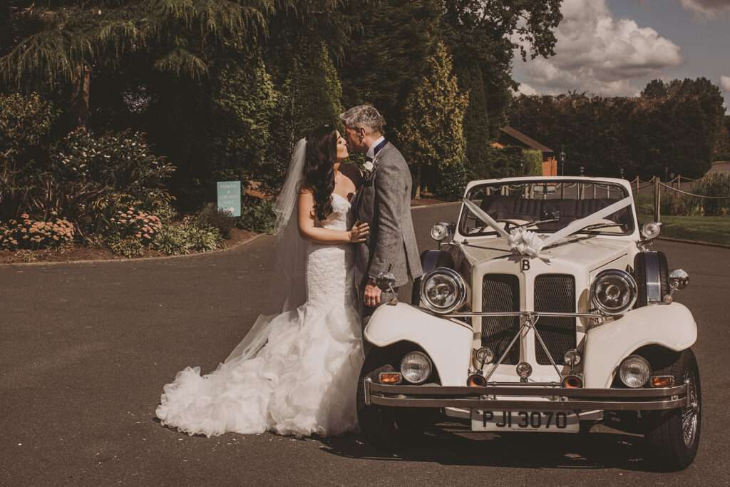 bride and groom kiss during their Colshaw Hall wedding photography portrait shoot