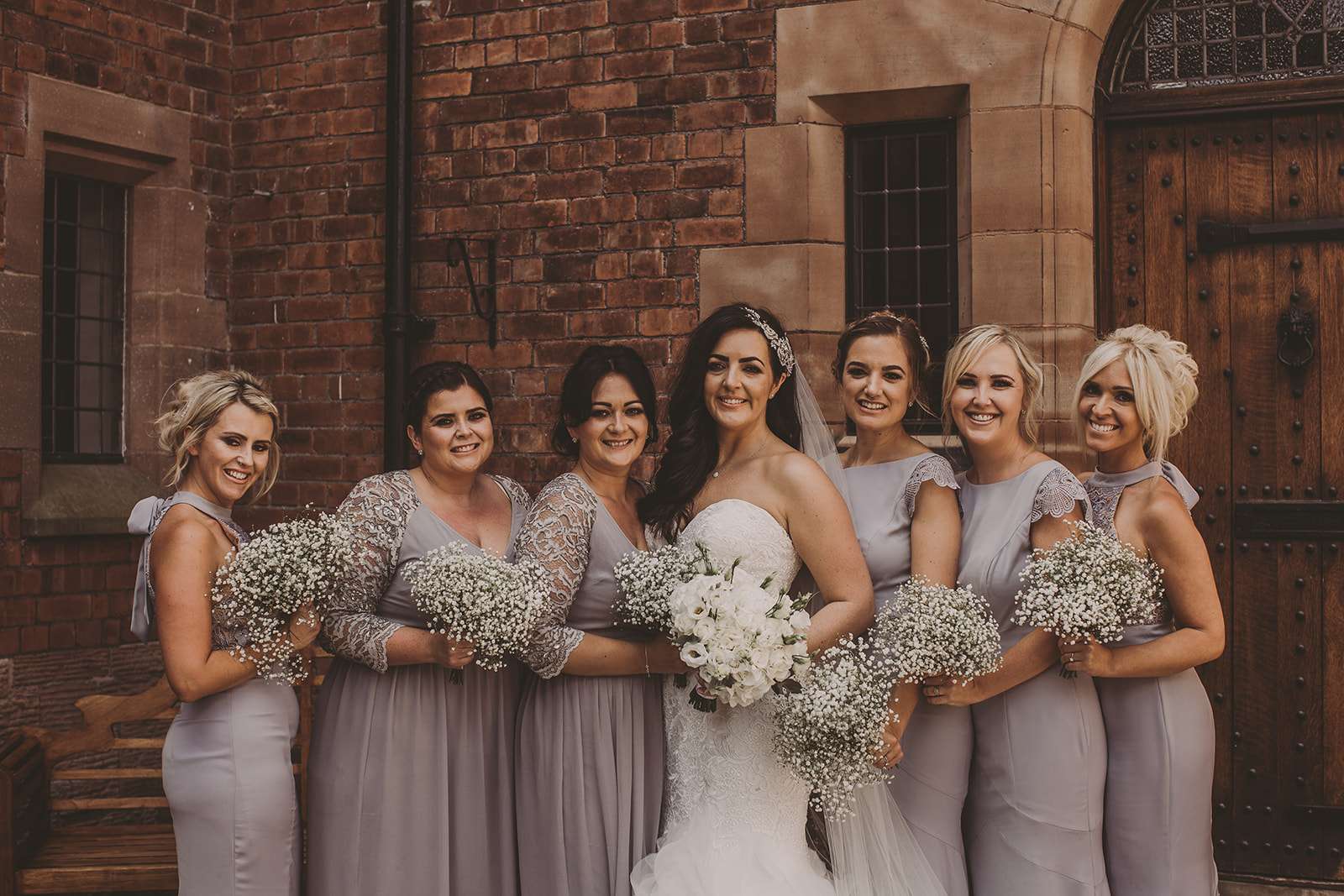 group photo of bridesmaids with bride outside Colshaw Hall