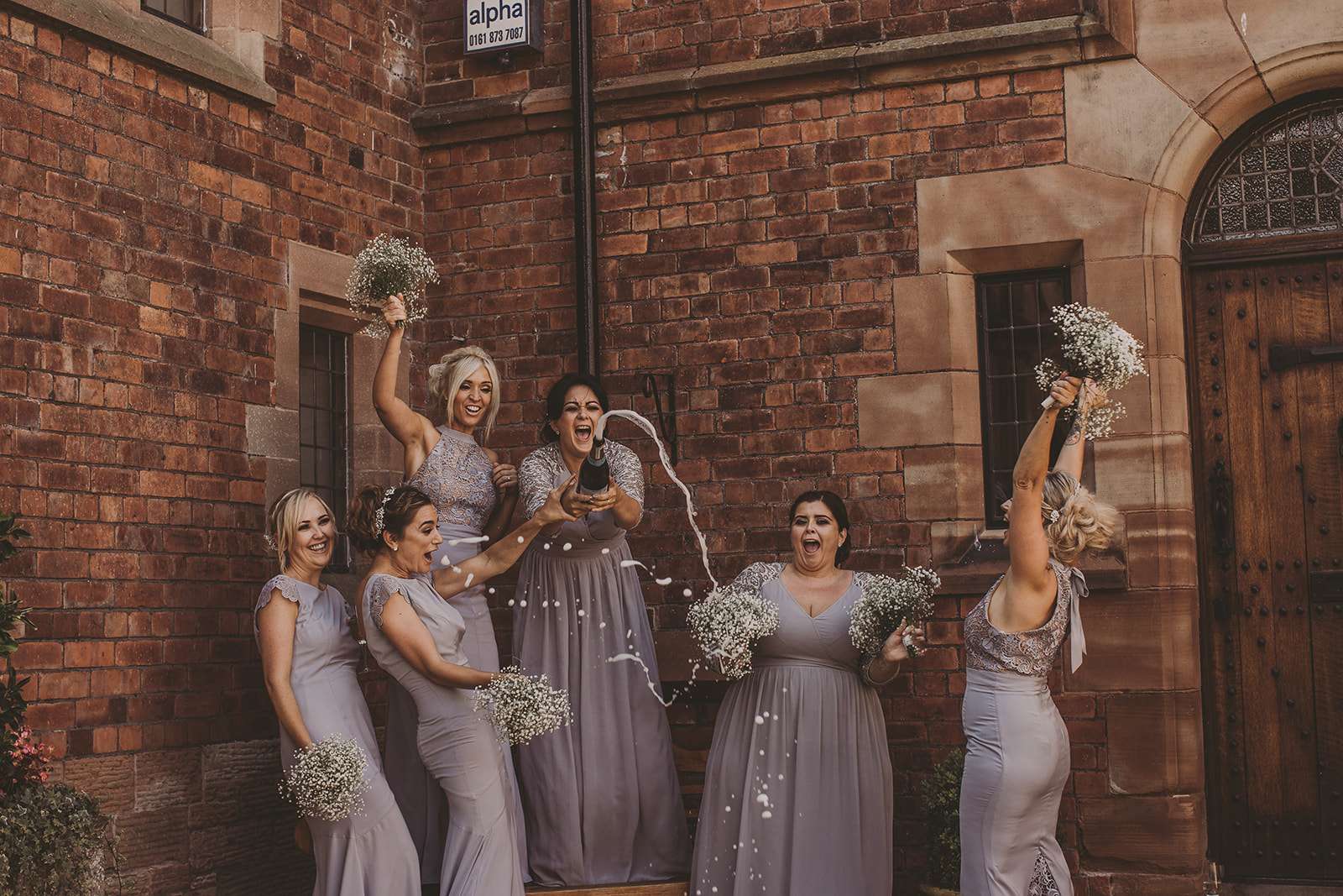 fun group photo of bridesmaids outside Colshaw Hall