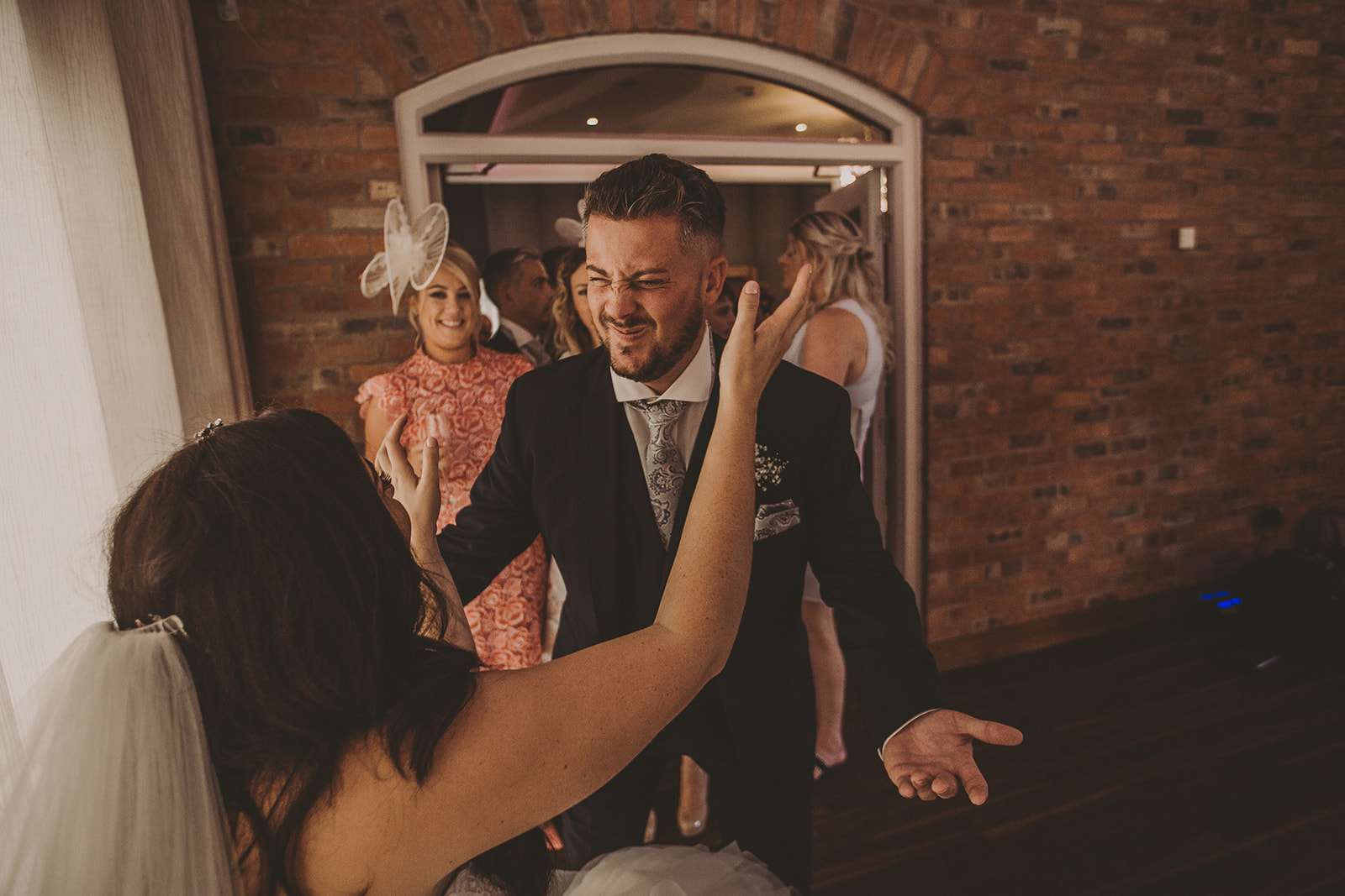 guests greet the bride and groom during their wedding breakfast at Colshaw Hall