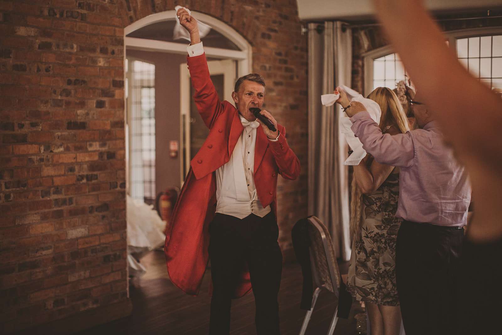 toastmaster announces the start of the wedding breakfast
