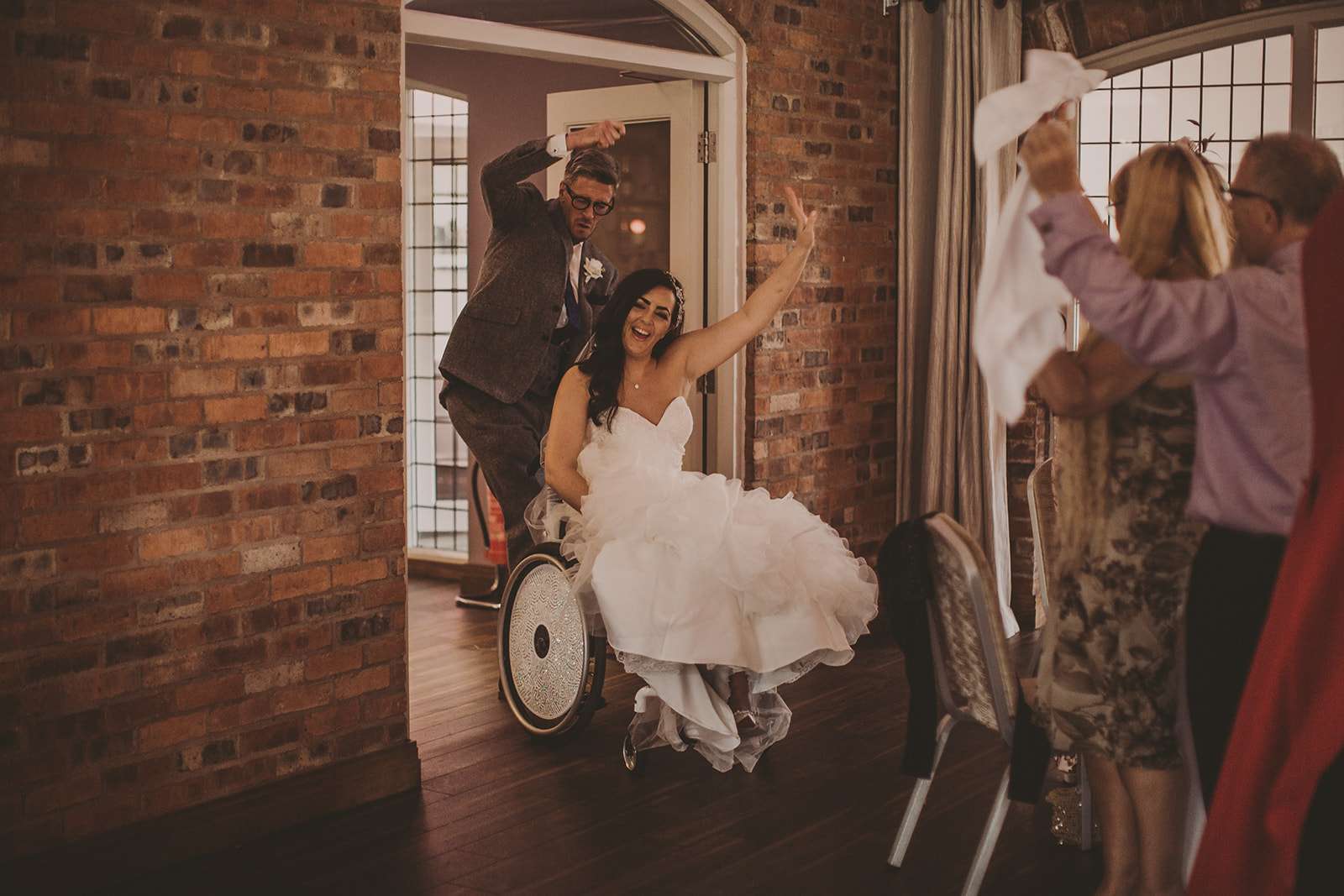 bride and groom entering the wedding breakfast room together at Colshaw Hall