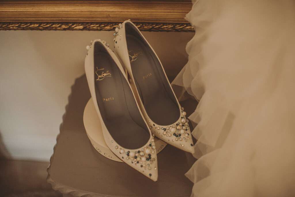 brides shoes with wedding dress, photographed at Colshaw Hall