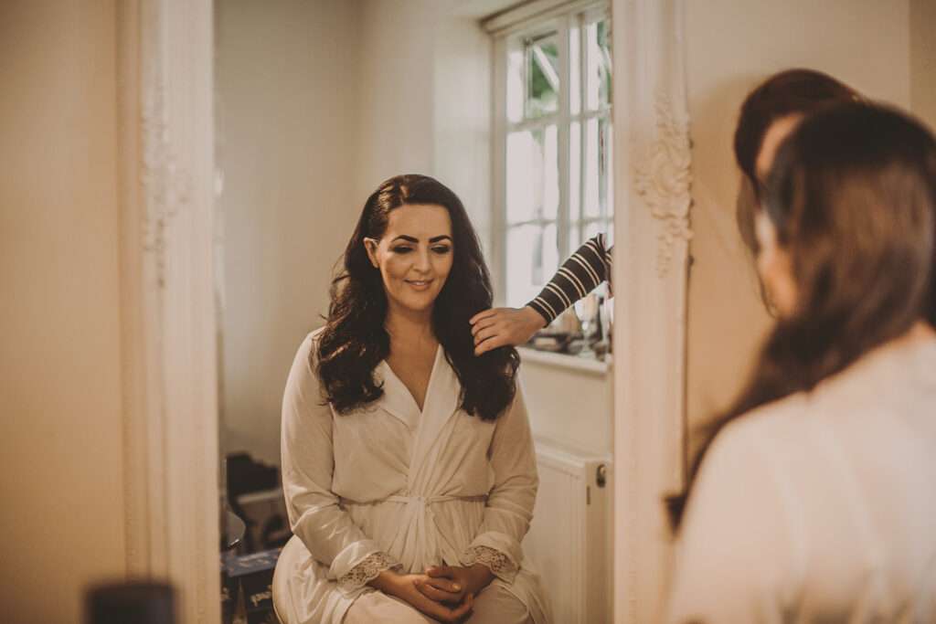 bride getting her hair styled bridal preparations at Colshaw Hall