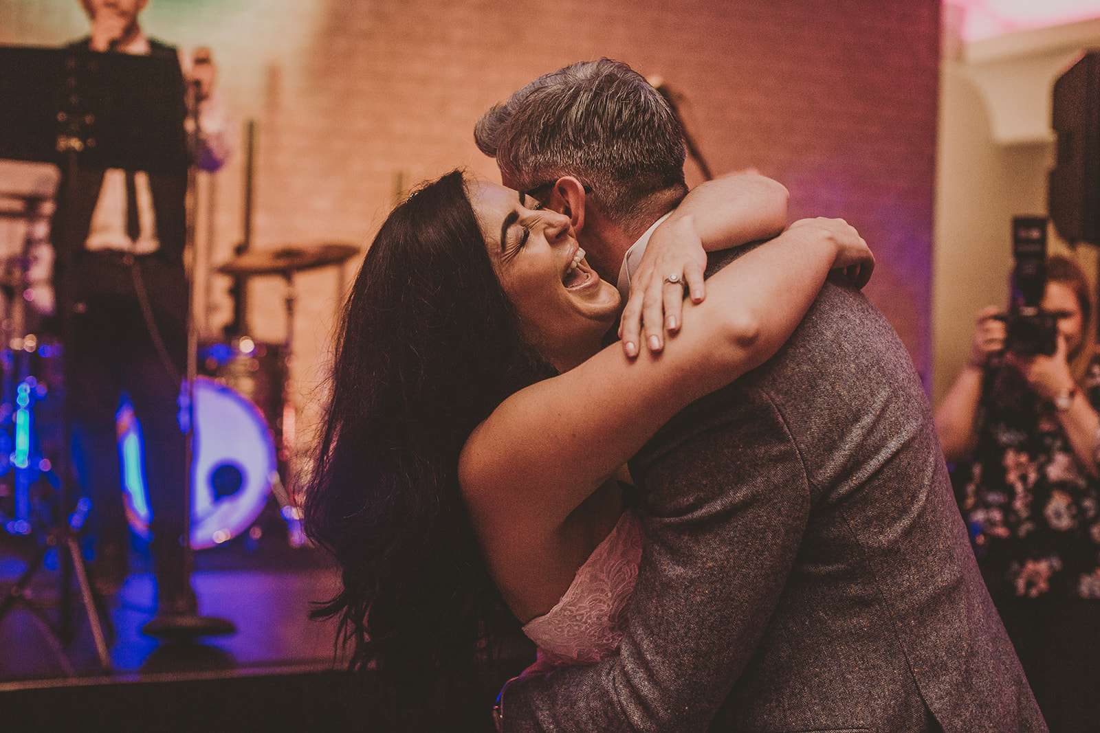 bride a groom embrace each other on the dancefloor at Colshaw Hall