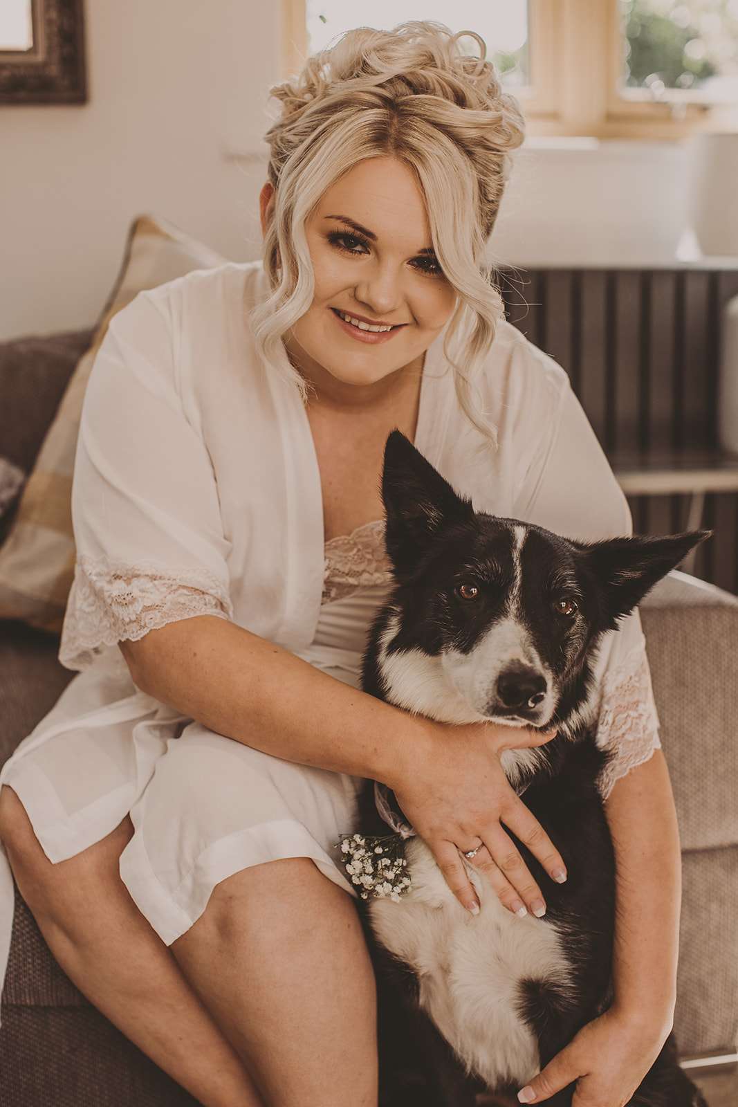 bride and ger dog pose for a portrait during morning preparations