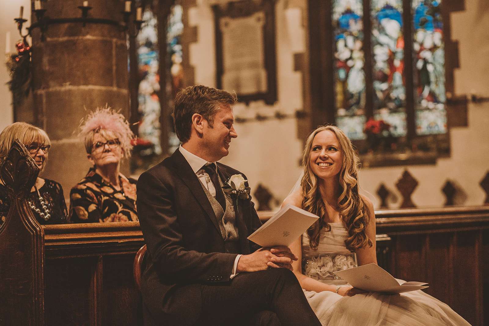 bride and groom sitting together during wedding ceremony