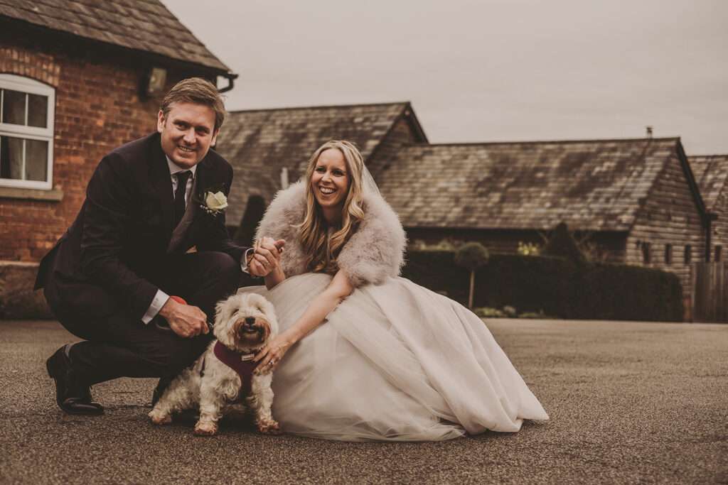 bride and groom portrait with their dog