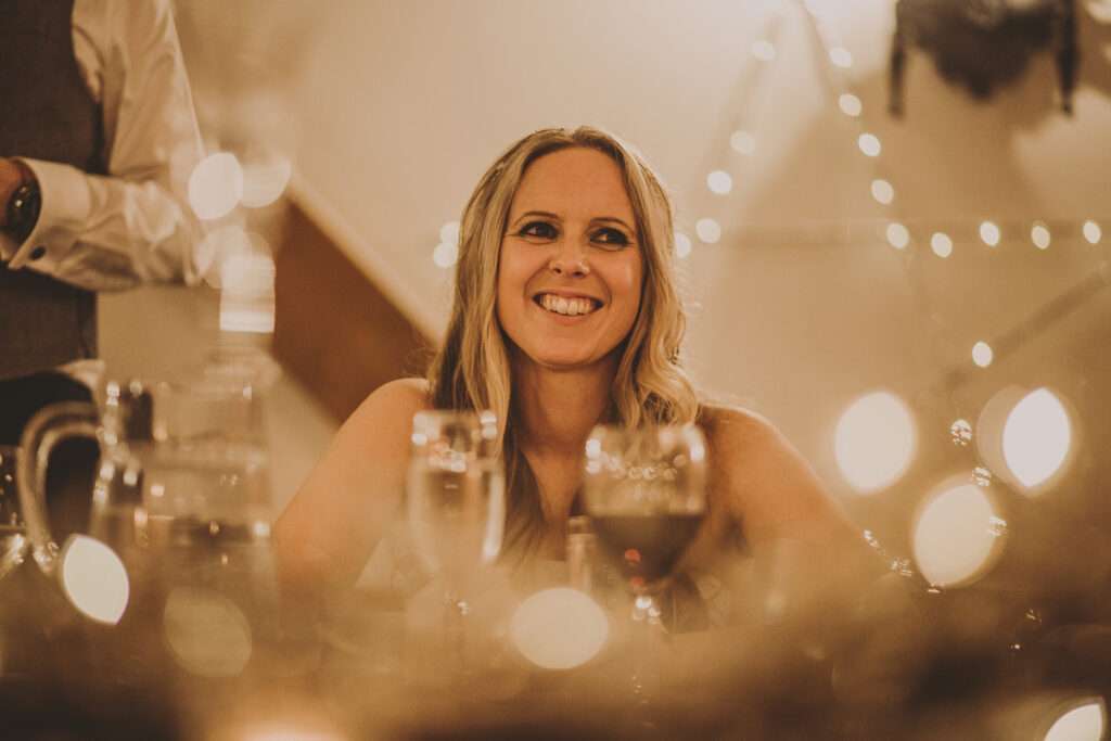 bride listens to speeches before wedding breakfast