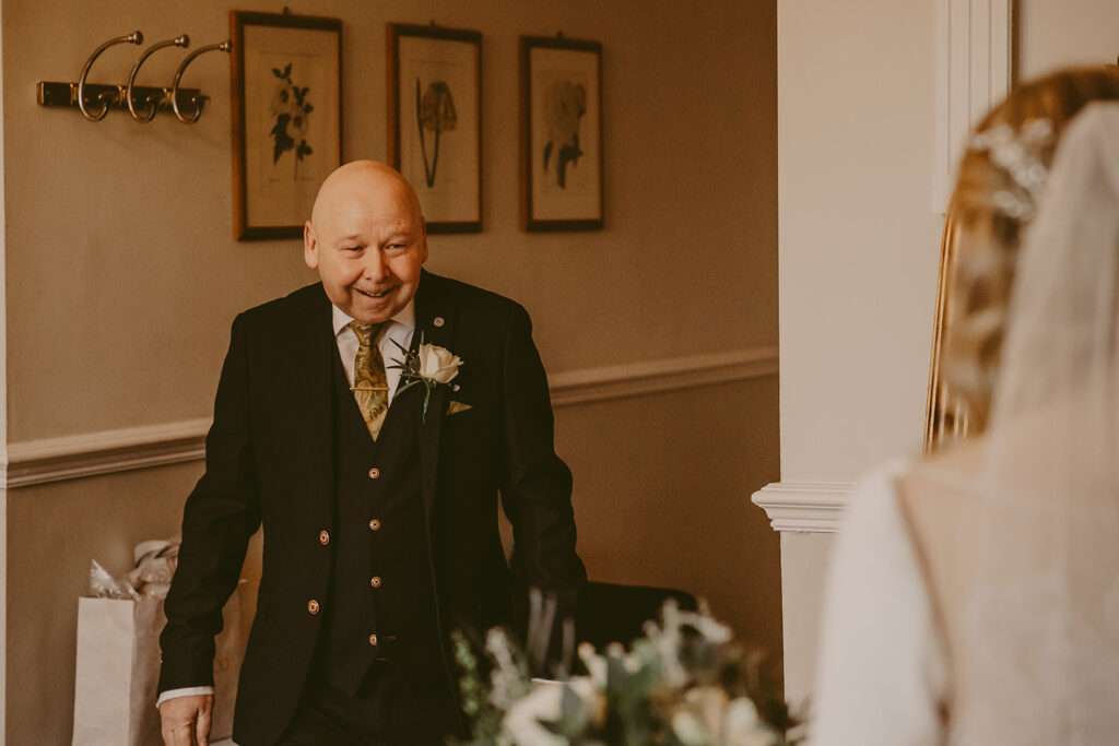 brides dad seeing her for the first time in her dress