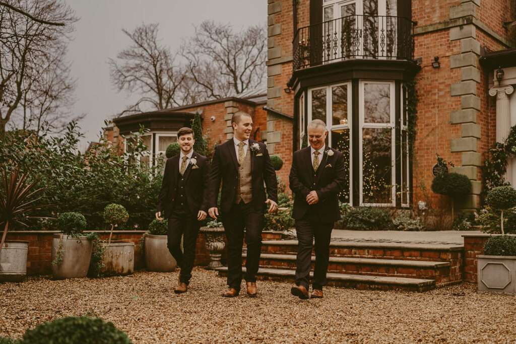 bride and his groomsmen outside Ashfield House