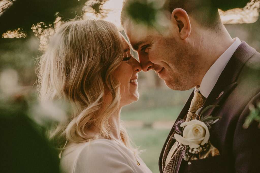 bride and groom looking at each other during their couple portraits