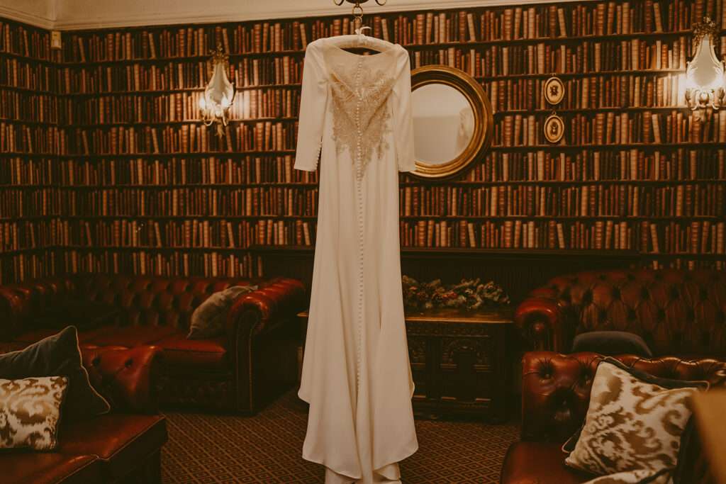 wedding dress hanging up during bridal preparations at Ashfield House