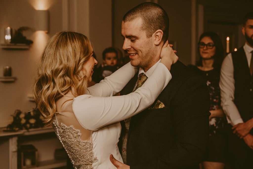 bride and groom dancing together